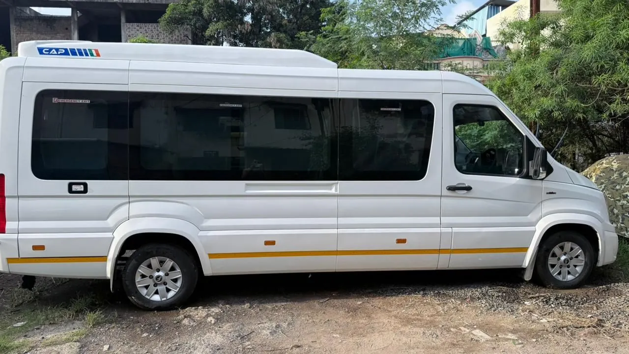 Force Urbania Omkareshwar temple tour van parked exterior - Force Urbania Indore rental